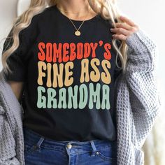 Funny Grandma Shirt, Somebody's Fine Ass Grandma T-Shirt. Product Description: - Made From 100% Cotton. - Sizes From S To 3xl. Thanks For Your Visit. Have A Nice Day!!! Best Grandma Shirt, Trendy Black Top With Funny Print, Black Funny Print Graphic Tee, Trendy Black Shirt With Funny Text, Funny Grandma Shirts, Funny Grandma, Best Grandma, Grandma Shirt, Grandma Shirts