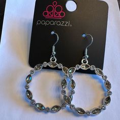 New. Paparazzi Brand. Silver Sparkling Hoop Earrings For Parties, Sparkling Silver Hoop Earrings For Party, Silver Glamorous Hoop Earrings For Anniversary, Glamorous Silver Hoop Earrings For Anniversary, Nickel-free Crystal Earrings For Party, Nickel-free Round Crystal Earrings For Party, Silver Metal Hoop Earrings With Rhinestones, Party Crystal Earrings With Rhinestones And Sterling Silver, Silver Crystal Hoop Earrings With Bling