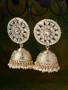 These gorgeous gold-toned round floral jhumki earrings come with kundan stone studs and off-white beads, are gold-plated, and secured with a post and back closure. These handcrafted dome jhumkis can be styled with any traditional outfit, or an evening outfit to complete a captivating look. Product color may vary based on the monitor or screen you are using.See FAQ for more details. Size Length: 8 cm Details Material: BrassStones: Kundan & Artificial BeadsPlating: Gold-plated Luxury Kundan Jhumkas With Stone Work, Gold Kundan Jhumkas For Festivals, Festival Jhumkas, Gold Kundan Jhumkas For Diwali, Bollywood Style Brass Chandbali Jhumkas, Eid Chandbali Jhumkas With Mirror Work, Bollywood Style Gold Kundan Jhumkas, Bollywood Style Brass Jhumkas For Festivals, Temple Jewelry Style Round Jhumkas With Gota Work