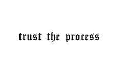 the words trust the process written in black ink