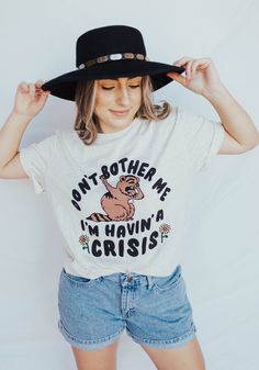 Don't bother me...I'm havin' a crisis! Get a little dramatic with this retro inspired tee. Featuring an overwhelmed who just cannot be bothered right now. Unisex tee in Oatmeal Triblend. Vintage-soft blend of 50% polyester, 25% combed cotton, 25% rayon.Model wears size Medium. Check the size chart for your perfect fit! Don't Bother Me, Mama Tee, Witch Outfit, Vintage Soft, Retro Vintage Style, Boyfriend Fit, Graphic Tees Women, Perfect Shirt, Workout Tee