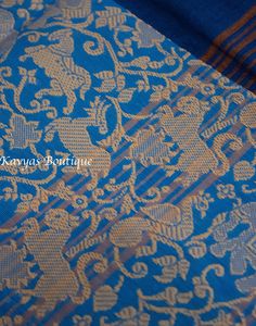 A Beautiful Blue Pure Cotton Vanasingaram Border Saree. The saree features a plain body with an elegant stiped pallu. The border on the bottom has a thread woven Vanasingaram pattern. Fall and pico are done. Does NOT come with blouse fabric.  Condition : New Fabric : Pure Cotton Blouse : No blouse fabric. Fall / Pico : Fall and pico are done. Washing : Dry clean only Occasion : Traditional, Religious , Festival, Special occasion, Party wear Note: We try to stay as accurate to the original colors Blue Bohemian Blouse With Zari Weaving, Bohemian Blue Blouse With Zari Weaving, Bohemian Handloom Pre-draped Saree For Wedding, Blue Handloom Pre-draped Saree For Eid, Blue Bohemian Handloom Blouse Piece, Bohemian Blue Handloom Blouse Piece, Blue Pre-draped Saree With Traditional Patterns For Puja, Bohemian Self Design Dupatta For Traditional Ceremonies, Bohemian Blue Saree With Traditional Patterns