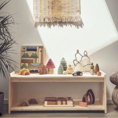 a shelf with various wooden toys on it