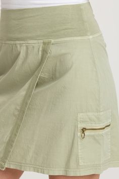 An antique brass hardware buckle and zipper pocket each grace one side of this mini wrap skirt. A pull-on waist and comfy poplin fabric make Noriko fit for sports and leisure alike! Brio Poplin: 97/3 Cotton/Spandex. Jersey Waistband: 92/8 Cotton/Spandex. Center Front: ~18.25". Center Back: ~19.25". Color Description: Subtle lime green. Preshrunk. Machine washable. Imported. MODEL Bailey is wearing size Small. Height: 5'10" | Bust: 34B | Waist: 26" | Hip: 37" Mini Wrap Skirt, Mini Wrap, Antique Brass Hardware, Lifestyle Clothing, How To Make Shorts, Poplin Fabric, Petite Size, Brass Hardware, Wrap Skirt