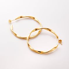 Our Ripple Hoop Earrings are inspired by the ripple effect that a pebble can cause in the ocean - these hoops stand as a reminder that you can have a ripple effect on the world with even the smallest action. Materials & Warranty Material: Real 18 karat gold plating on pure stainless steel Hypoallergenic | Sensitive Skin-Friendly Warranty: Lifetime Warranty against all rust or tarnish Packaging: Nominal Velvet Drawstring Pouch Earrings cannot be returned or exchanged due to hygienic safety Modern Twist Hypoallergenic Hoop Earrings As Gift, Modern Twist Hypoallergenic Hoop Earrings For Gifts, Modern Twist Hoop Earrings As Gift With Polished Finish, Modern Twist Polished Hoop Earrings As Gift, Modern Twist Hoop Earrings For Everyday Wear, Modern Twist Round Earrings For Everyday, Modern Twist Nickel Free Hoop Earrings, Modern Twist Nickel-free Hoop Earrings, Hypoallergenic Hoop Earrings With A Modern Twist