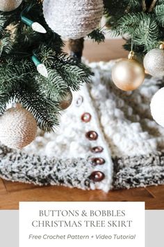 a crochet christmas tree skirt with buttons and bobbles on the bottom is shown