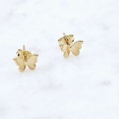 14kt gold filled butterfly stud earrings .2 inches Jewelry Care: Clean with a soft cloth and store in a jewelry bag. Tiny Butterfly Dainty Earrings, Tiny Dainty Butterfly Earrings, Dainty Tiny Butterfly Earrings, Rose Gold Butterfly Charm Earrings For Gift, Rose Gold Butterfly Charm Earrings As Gift, Gold Minimalist Earrings With Butterfly Charm, Minimalist Gold Earrings With Butterfly Charm, Elegant Butterfly Earrings For Everyday Wear, Rose Gold Hypoallergenic Butterfly Earrings