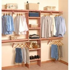 an organized closet with clothes and shoes