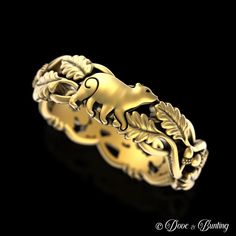 a gold ring with an animal on it