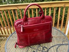 Super nice and elegant wine color handbag by Overland It is vintage in excellent condition It is 14" long by 12" tall Formal Burgundy Shoulder Bag With Double Handle, Formal Burgundy Double Handle Satchel, Red Top Handle Bag For Business, Red Top Handle Business Bag, Formal Burgundy Double Handle Shoulder Bag, Formal Red Shoulder Bag With Top Carry Handle, Burgundy Top Handle Shoulder Bag For Business, Elegant Red Formal Briefcase, Formal Burgundy Satchel Shoulder Bag