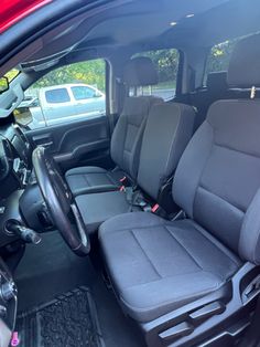 the interior of a vehicle with grey seats