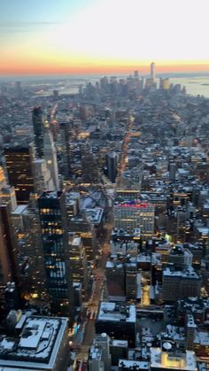 an aerial view of new york city at sunset from the top of the empire building