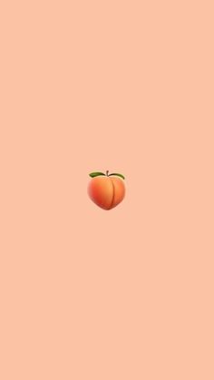 an orange is floating in the air on a pink background