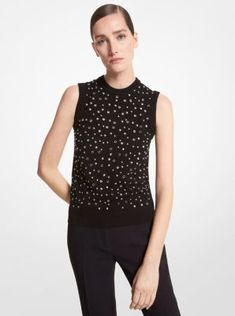 An effortless blend of hard and soft, this studded top is crafted from luxe cashmere and accented with high-shine grommets. The sleeveless design makes it the perfect transitional layer to partner with tailored separates. Fitted Embellished Sleeveless Camisole, Black Stretch Embellished Tops, Luxury Beaded Black Tops, Black Fine Knit Cashmere Tops, Glamorous Black Embellished Tank Top, Michael Kors Collection, Italian Fabric, Cashmere Sweaters, Cashmere