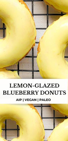 four lemon glazed blueberry donuts on a cooling rack with the words, lemon glazed blueberry donuts air i vegan pale