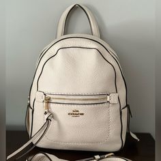 Coach Backpack, Never Used, New With Tags! Cream Color, Comes With Removable Strap White Leather Backpack With Zipper For Daily Use, White Rectangular Leather Backpack For On-the-go, White Leather Backpack With Zipper Closure, White Leather Backpack With Zipper Closure For Everyday, Leather Backpack With Zipper Closure In Cream, White Backpack With Removable Pouch, Cream Leather Backpack With Zipper Closure, White Standard Backpack With Removable Pouch, Luxury White Leather Backpack With Adjustable Strap