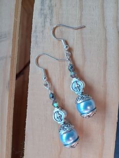 Blue crystal pearl earrings featuring the Miraculous Medal. Jewelry Pearl Earrings, Medal Jewelry, Crystal Pearl Earrings, Jewelry Pearl, Miraculous Medal, Swarovski Crystal Earrings, Catholic Gifts, Christian Jewelry, Pearl Jewellery Earrings