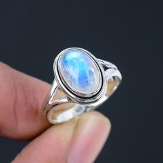 Rainbow Moonstone Gemstone Silver Ring  Gemstone - Rainbow Moonstone  Gemstone Creation - Natural  Metal - Silver Metal Purity - 925 Sterling Silver   Ring All Size Available  Note - Due to the Natural Formation of this Gemstone. Slight variation in texture and color but stone shape is same. Listing photo showing the design. Each Stone Color Little Bit Differ then the photo of the listing.  5 Major Benefits of Wearing Rainbow Moonstone Ring -  1. Emotional Balancer of Rainbow Moonstone 2. Target Your Feminine Side of Rainbow Moonstone 3. Calm Your Masculine Side of Rainbow Moonstone 4. Helps To Even Out Your Sleep Cycle of Rainbow Moonstone 5. Good For Nosebleeds and Other Ailments Of Rainbow Moonstone Will Ship Your Order Within 3-5 Days. We Have 3 Type Of Shipping Services Available - 1. Moonstone Engagement Ring Rose Gold, Moonstone Ring Sterling Silver, Moonstone Engagement Ring, Rainbow Moonstone Ring, Natural Rainbow, Ring Gemstone, Moonstone Ring, Ring Ring, Ring Jewelry