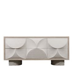 a white and grey cabinet with three circular shapes on it