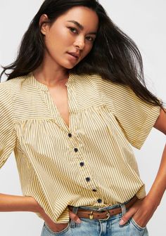 Introducing the Flip Swingy Blouse- Polo Lounge, the perfect addition to your spring wardrobe. This versatile top features a casual notch neckline and gathered seam at bust for a flattering fit. With its boxy short sleeves and muted yellow background with deep navy stripes and buttons, it can easily take you from day to night. Don't miss out on this must-have capsule style! Polo Lounge, Nation Ltd, Coffee Dates, Spring Capsule, Blouse Sale, White Polo, Spring Wardrobe, Navy Stripes, Low Key