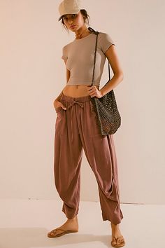 Breezy and effortless, these timeless pants from free-est are a true seasonless staple. **Fit:** Mid-rise, relaxed harem fit **Features:** Pull-on design, drawstring closure, dropped pouch pockets, tucked pleating seam **Why We ❤ It:** Off-duty with your favorite tee or perfectly paired with the matching skirt, this pair has endless ways to wear. | Take Me With You Linen Pants by free-est at Free People in Brown, Size: XS Massage Therapist Outfits For Women, Natural Fibers Clothing, Linen Pants Outfit, Dream Outfits, Granola Girl, Street Style Summer, Fashion Baby, Linen Trousers, 2024 Fashion