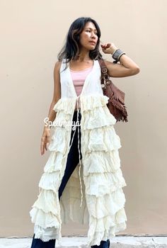 Handmade ruffled long jacket with strings to tie in the front. 100% raw organic cotton. 5 colors. Wear with short or jean. One size fit most figure. 2 color2. White Cream One size: S-L bust free up to 44 inches waist up to 44 inches hips max to 60 inches length 52 inches CARE: Machine wash cold. Bohemian Spring Beach Duster Cover-up, Bohemian Spring Duster With Open Front, Bohemian Open Front Duster For Spring, Bohemian Spring Open Front Duster, Spring Bohemian Open Front Duster, Bohemian Open Front Cover-up With Tassels, Bohemian Open Front Festival Cover-up, Long Hippie Festival Cover-up, Free-spirited Spring Festival Cover-up