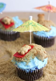 cupcakes with blue frosting and an umbrella on top