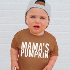 Mama's Pumpkin , Pumpkin Patch Shirt , Pumpkin Head , Pumpkin Shirt , Toddler Shirt , Baby Shirt , Fall Shirts , Fall Toddler Shirts G A R M E N T ∙ F E A T U R E S : * Uniquely soft fabric * Modern, unisex fit * Crew neck and short sleeves - Has a great comfortable fit you are sure to love F I T ∙ & ∙ S I Z I N G * Please consult size chart in pics for accurate fit. Please keep in mind that there are always slight variations in sizing. - Remember unisex tee's fit on the bigger side. F A B R I C Cute Brown Crew Neck T-shirt, Family Matching Cotton Shirt For Playtime, Cute Brown Short Sleeve T-shirt, Cute Fall T-shirt For Playtime, Brown Cotton Graphic Tee, Fall Playtime Tops With Short Sleeves, Short Sleeve Tops With Name Print For Playtime, Family Matching Short Sleeve Tops For Fall, Brown Long Sleeve Tops For Playtime