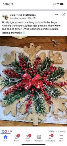 a christmas decoration on top of a table with snowflakes and red berries in the center