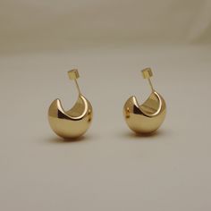 These bold yet classy chunky dome hoops elevate your style and go with any day or night outfit. Hand polished in 18k gold vermeil. Vermeil is a thicker layer of 18k solid gold e-plated on a base of premium 316L surgical steel. Handcrafted with e-plated 18K gold plating for thickness and durability Hoop Diameter: 12mm 316L stainless steel base Hypoallergenic Tarnish and water resistant Dome Earrings, Night Outfits, Statement Jewelry, Gold Plating, Gold Vermeil, Moonstone, Gold Earrings, Solid Gold, Silver Earrings