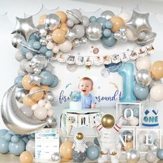 an image of a baby's first birthday with balloons