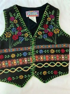 VINTAGE.  Black 100% cotton vest / waistcoat, 4 button, with bright colored stitching and flowers. Colors are Red, Blue, Purple, Green, and Yellow. Child's Small. Back has loop for tightening.   One button is missing top- needs to be replaced. Waistcoat Design, Stitching Flowers, Waistcoat Designs, Pink Clothes, Vest Waistcoat, Kid Clothes, Cotton Vest, Bright Colored, Grade 3