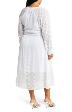 This delicate dotted maxi dress is the perfect lightweight summer dress for any formal occasion. 58" front, 57" back (size 1X) V neckline Button down closure Long sleeve 100% polyester Machine wash cold, tumble dry low Imported Model Stats: 5'10" height; 41" bust; 36" waist; 48" hips. Model is wearing size 1X. Spring Daywear Swiss Dot Dresses, Spring Swiss Dot Dresses For Daywear, Polka Dot Swiss Dot Midi Dress, Long Sleeve Polka Dot Midi Dress For Summer, Elegant Polka Dot Maxi Dress For Summer, Elegant Swiss Dot Dresses For Daywear, Summer Long Sleeve Maxi Dress In Polka Dot, Summer Long Sleeve Polka Dot Maxi Dress, Polka Dot Long Sleeve Maxi Dress For Summer