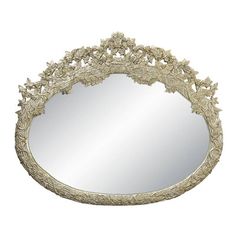 an ornately decorated mirror is shown against a white background