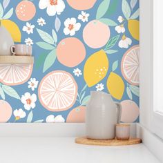 a kitchen wall with oranges and lemons on it