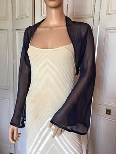 This is a beautiful hand made ivory chiffon shrug with long FLARED sleeves ideal for weddings or special occasions. It can also be worn with casual wear. It has a silver edging. It can be made in any size from 8 to 24 (UK sizes). It is made in the UK. It is normally sent out to you within 5 days, but I am very happy to make your order a priority if you need it urgently. Just let me know the date needed by. Postage is free in the UK! International postage is £9. I am happy to exchange items or re Dress Coverup Ideas, Chiffon Kimono Jacket, Chiffon Shrug, Chiffon Bolero, Dress Designs For Girls, Shrug Jacket, Bolero Shrug, Chiffon Kimono, Lace Kimono