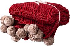 two teddy bears laying on top of a red blanket with three smaller stuffed animals under it