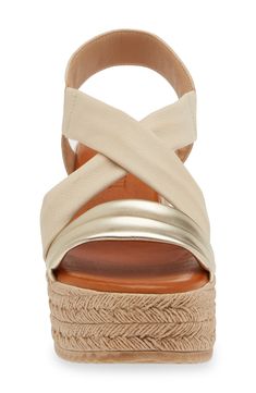 Crisscrossing vamp straps lend modern dimension to an espadrille-inspired sandal lifted by a jute-wrapped platform and integrated wedge heel. 2 1/2" heel; 2" platform (size 39) Cushioned footbed Leather or textile and synthetic upper/textile and synthetic lining/synthetic sole Made in Spain Gold Wedge Sandals With Cushioned Footbed For Vacation, Gold Espadrilles With Woven Sole For Summer, Gold Espadrilles For Summer, Gold Wedge Sandals With Cushioned Footbed For Beach, Gold Beach Wedge Sandals With Cushioned Footbed, Gold Espadrilles With Woven Sole For Beach, Gold Espadrilles With Woven Sole For Vacation, Gold Espadrilles With Woven Sole For Spring, Spring Crossover Sandals With Heel Strap