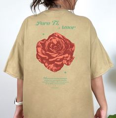 "Aesthetic Shirt with Rose, Vintage Rose shirt, Beautiful flower shirt, retro rose streetwear shirt, Para Ti Amor by Push For More Hi! Welcome to my store! Thanks for the support! Para Ti, Amor, with design on front and back! Designed with Love An illustrated rose paired with a love note written in Spanish. That reads \" Mientras los peddles aguantan, con fuerza y paciencia, unable flor maestro su belleza. Me acuerdo de ti, de tu alma y de tu corazón\". A timeless pair. Wear it as a statement pi Streetwear Shirts, Rose Shirts, Thanks For The Support, Aesthetic Shirt, Red Team, Love Note, Rose Vintage, Aesthetic Shirts, Flower Shirt