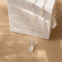 Pretty, dainty and totally adorable! Introducing our Mini Initial Paperclip Necklace, a stylish and personalized accessory that adds an understated and fun touch to your outfit. Crafted with meticulous attention to detail, this necklace features a mini tag that can be engraved with your desired letter or symbol. The contemporary paperclip chain design adds a modern twist, making it a versatile piece for daily wear or special occasions. Material: High Quality Solid 925 Sterling Silver Finish: Ste Trendy Personalized Everyday Charm Necklace, Minimalist Charm Necklace For Best Friend Gift, Minimalist Charm Necklaces For Best Friend Gift, Minimalist Initial Necklace With Charms As Gift, Minimalist Paperclip Chain Jewelry For Mother's Day, Simple Paperclip Chain Necklace Gift, Simple Paperclip Chain Necklace As Gift, Trendy Sterling Silver Charm Necklace As A Gift, Minimalist Sterling Silver Charm Necklace For Best Friend