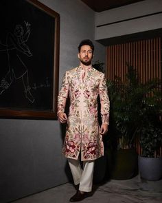 *2 Piece Peach, Men's Sherwani With Multi Colour  Machine Embroidery, Groom Sherwani *Fabric: %100  Raw Silk , Thick, Warm, Comfortable, Breathable, Softer, Satin Feeling *Center Hide Button with Hooks, With Zipper Fly Pants *This Suit Has A 6" Drop Which Is The Difference Between The Size Of The Sherwani & Pants. For Example, A 40r Jacket Includes A 34W Pant *Dry Clean Only Important Note: All Our Products Are Made To Order ! Please Contact Us For Perfect Fitting Suit. .Full Lining  Sherwani Wi Ambani Wedding, Varun Bahl, Groom Dress Men, Mens Sherwani, Tiger Shroff, Womens Suits, Indian Groom, Bollywood Wedding, Looking Dapper