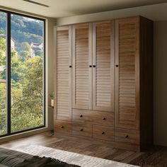 a bedroom with large windows and wooden furniture