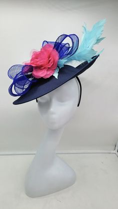 Beautiful large blue fascinator adorn with sky blue feathers and and hot pink  flowers. Style to go with a variety of outfits: bridesmaids,  cocktail party,  Kentucky Derby, Rehearsal dinner, Easter and church outfits.  Ones with hair clip and headband. Are you trying to match an outfit? Send a picture and I will help you find a best hat to match your outfit.  - Rare find - Ready to ship  - Lightweight - Free Shipping - Fast shipping - Customize by adding different color flowers and or feathers Check my store for for styles and colors.  etsy.com/shop/hatsandpearls Find more at my website: Www.hatsandpearls.com  reach out to me if you can't find what you are looking for.  I can make cake custom orders and help you style and match your outfit  Thank you for visiting! Spring Blue Fascinator With Short Brim, Blue Costume Hats And Headpieces For Races In Spring, Blue Costume Hats And Headpieces For Spring Evenings, Spring Blue Mini Hats With Handmade Flowers, Blue Headpieces For Spring Weddings, Blue Fascinator For Kentucky Derby Garden Party, Blue Hats With Handmade Flowers For Royal Ascot, Blue Fascinator With Handmade Flowers For Kentucky Derby, Blue Fascinator For Royal Ascot Garden Party