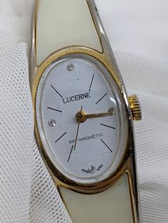 Vintage LUCERINE Ladies Watch WIND-UP hinged band - Hong Kong 1970's Working. Good condition, working wind-up mechanical watch. Gold/white colored plastic opening band suits a smaller wrist; 16cm to 18cm wrist / white colored dial. Crystal has some light scratches, see pictures. PLEASE NOTE! Very old watches and clocks, especially the wind-up mechanical type, are notoriously unreliable and temperamental. Although they may be listed as 'working' this does not mean that they can be relied on like Vintage White Watch Accessories With Round Dial, Vintage White Round Dial Watch Accessories, Vintage White Analog Watch, White Retro Watch For Formal Occasions, Retro White Watches For Formal Occasions, White Retro Formal Watch, White Retro Formal Watches, 1970s Bands, Australian Vintage