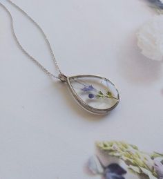 "Real flower necklace, woodland necklace, terrarium necklace, botanical necklace, real flower pendant, pressed flower necklace, resin finding These unique handcrafted necklaces are designed specifically for you! Made with natural flowers from the wild, this necklace is dainty, lightweight and it makes a perfect statement. Every VBRTN item is handmade with care in my Denver, CO studio. As someone that has passion for creating timeless healing pieces that you will fall in love with, I strive to tr Pressed Flowers Necklace With Oval Pendant As Gift, Oval Pendant Necklace With Pressed Flowers For Gift, Nature-inspired Pendant Necklace As Gift For Her, Gift Oval Pendant Necklace With Pressed Flowers, Botanical Sterling Silver Jewelry Gift, Keepsake Jewelry Round Pendant With Natural Inclusions, Minimalist Birth Flower Jewelry Keepsake, Keepsake Round Pendant With Natural Inclusions, Nature-inspired Teardrop Pendant Necklace As Gift