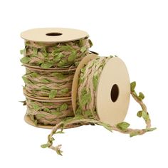 some spools of twine with leaves on them