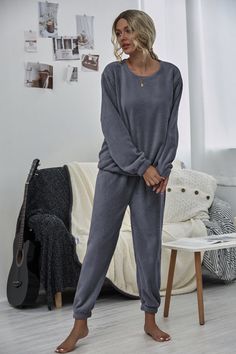 Keep your loungewear casual-cool with this sweatshirt and joggers set featuring a comfortable stretch-infused fit. Includes sweatshirt and matching joggers (two pieces total) Size Guide: Talita s 5’6” tall, and has a 33” bust, 24” waist, & 35” hips. She is wearing a S / US 4 / AU 8. This loungewear set is true to size. Sweatshirt (size S): 29" long from high point of shoulder to hem Joggers (size S): 27" inseam Material: 100% polyester Care Instructions: Machine wash / Cold hand wash Home Outfits Men, Cozy At Home Outfits, At Home Outfits, Cozy At Home, Blue Crewneck, Grey Crewneck, Loungewear Sets, Loungewear Set, Jogger Set