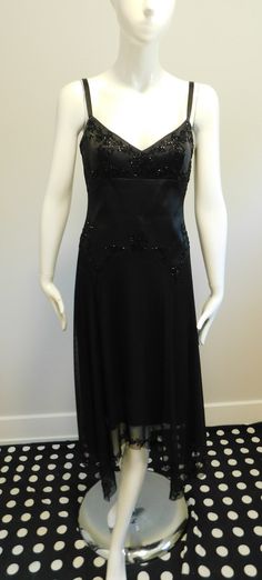 This dress is definitely channelling the flappers of the 1920's but with a modern edge The bodice is shaped to accent not hide the bust Black peau de soie strap dress with bugle beads  Shaped drop waist adds more emphasis to the hip with beading Skirt of stretch tulle edged with bugle beads  Handkerchief hem Fully lined  Beads are plastic Labeled - Laundry by Shelli Segal                  100% Polyester Size - XS Please scroll through photos for measurements 1920s Modern Fashion, Vintage Dresses 1920's, 1920s Fashion Dresses, Gogo Dress, Fish Dress, Beaded Skirt, Vintage Black Dress, Handkerchief Dress, 1920s Dress