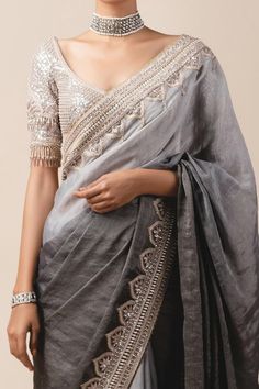 Grey ombre georgette tissue saree with dome motif hand embroidered border. Paired with sheathing blouse enhanced with 3D flower sleeves and bead tassels.
Component: 2
Embroidered
Neckline: U Neck
Sleeve Length: Half
Fabric: Georgette, Silk Tissue
Color: Grey
Cutout back
Bead tassel
Tassel tie-up back
 - Aza Fashions Diwali Sheer Dupatta Blouse In Dola Silk, Organza Blouse With Intricate Embroidery, Elegant Art Silk Blouse With Sheer Dupatta, Organza Blouse With Intricate Embroidery And Traditional Drape, Tissue Silk Blouse With Dupatta For Transitional Season, Sheer Dupatta Blouse Piece For Reception, Transitional Tissue Silk Blouse With Dupatta, Transitional Organza Blouse With Intricate Embroidery, Chinon Blouse With Traditional Drape For All Seasons