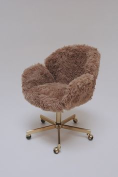 a small chair with wheels and a furry seat cover on it's back legs